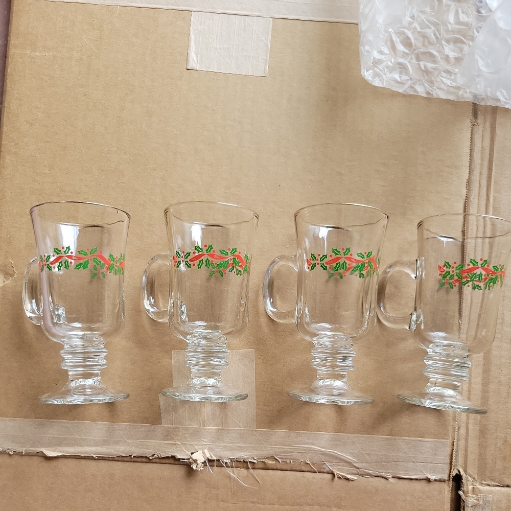 4 dessert or drink holiday mugs.